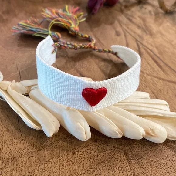 White Woven Embroidered Tassel Bracelet with Red Heart Accent - Picture 4 of 8